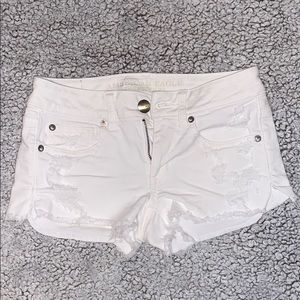 White distressed AEO shorts